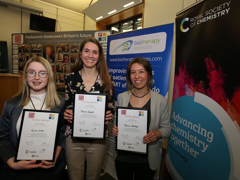 STEM for Britain winners Dr Gemma Smith, Florence Gregson and Fabienne Bachtiger hold their certificates and smile at the camera