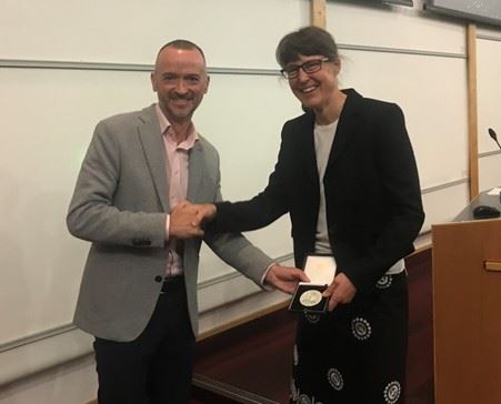 Professor Alison Hulme receives the Bader Award from  Professor Stuart Conway