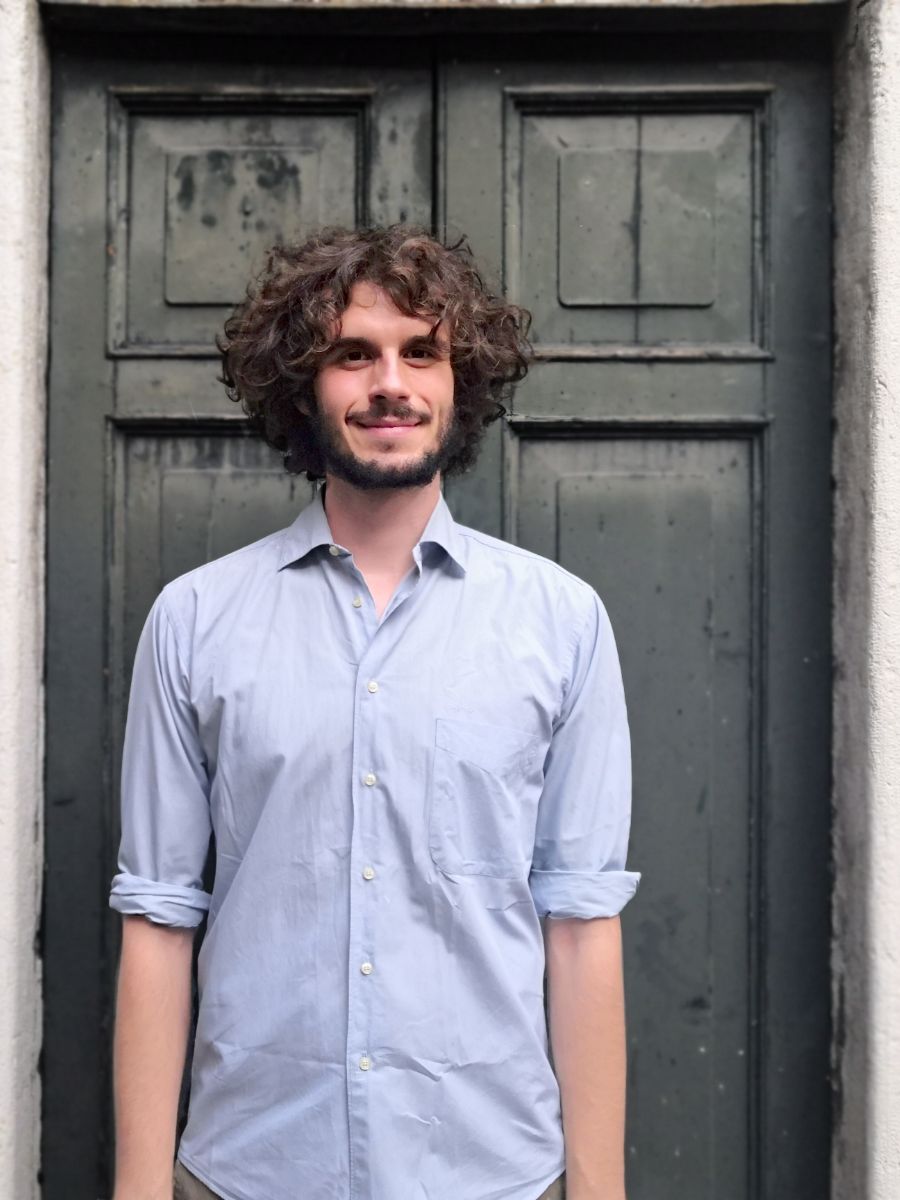 Emanuele penocchio standing in front of door