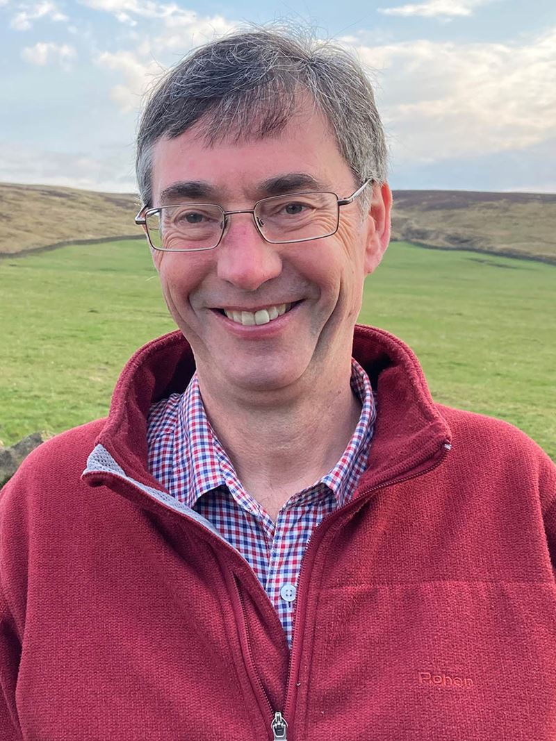 Kevin Jones headshot, wearing red fleece