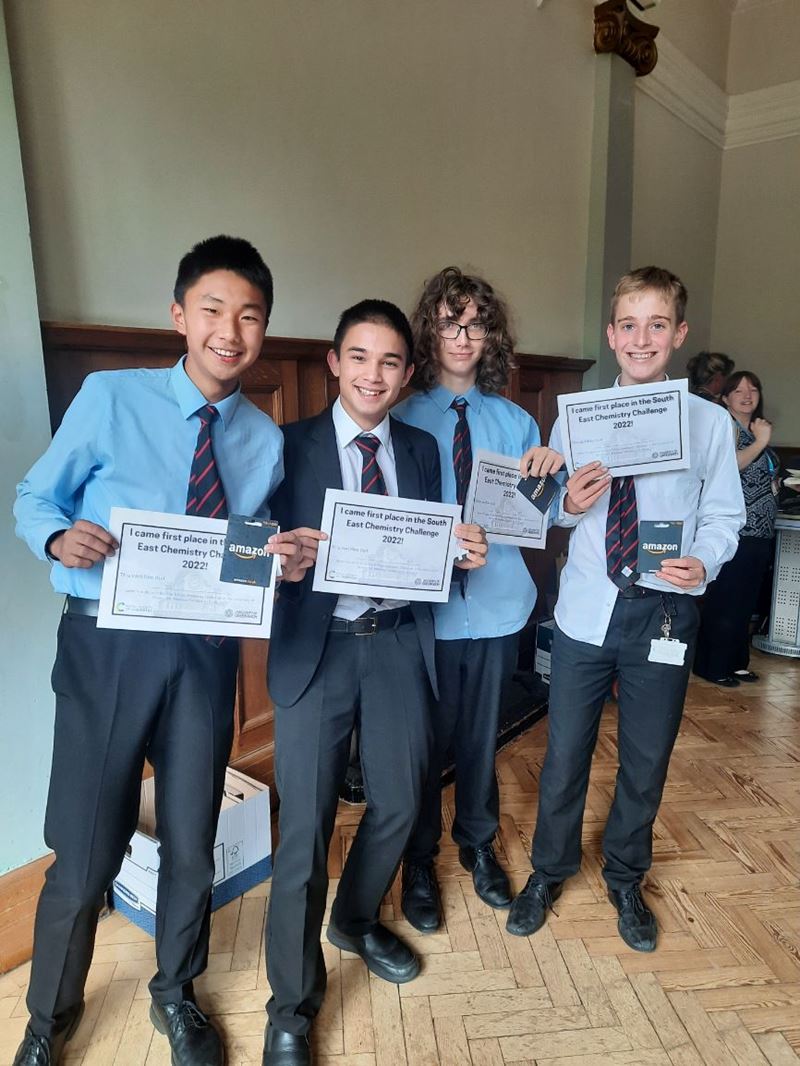 The team from Magdalen College School hold aloft their certificates for winning the South East Chemistry Challenge