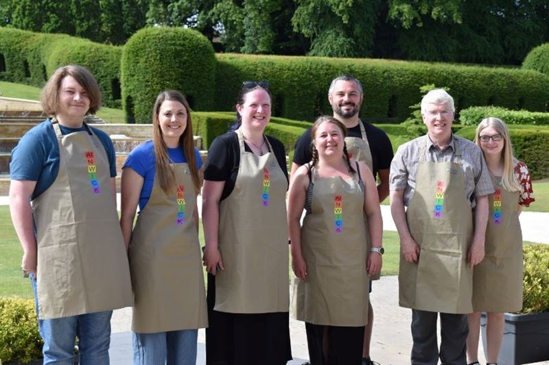 The volunteer team behind the event wearing specially designed chemistry aprons