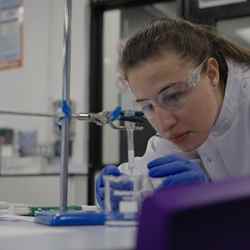 A competitor looks at some lab equipment during the final