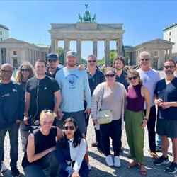 The RSC's Open Access focus group stands in front of Berlin's Brandenburg Gate on a gloriously sunny day