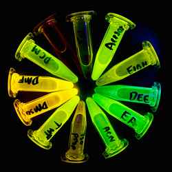 Joy Karmakar's 'The Wheel of Fluorescence' shows a series of illuminated, fluorescent items in a circle on a black background