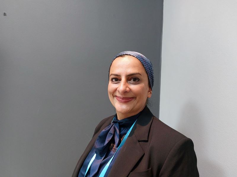 A portrait of Dr Rehana Sidat of GSK in front of a grey background