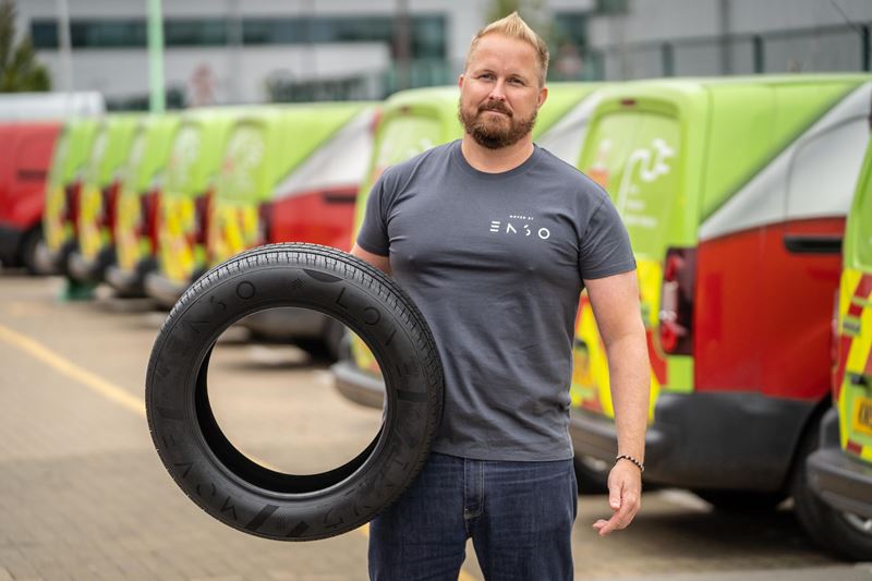 Gunnlaugur Erlendsson, founder and CEO of ENSO, holds up an ENSO tyre with one arm