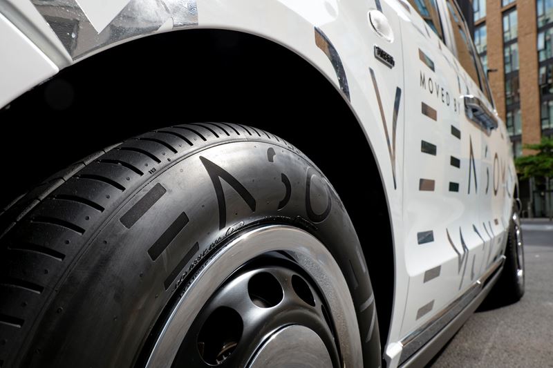 A close-up of an Enso tyre on a London taxi decorated with ENSO branding