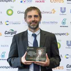 Professor Stuart Scott, of the University of Cambridge, holds the trophy after H2Upgrade won the 2024 Energy award