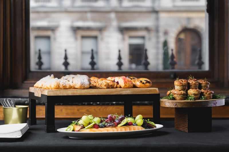 pastries and fruit presented near window