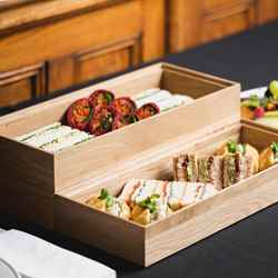 sandwiches and wraps presented in wooden box