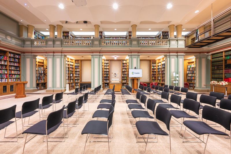 bookshelves and rows of chairs in library