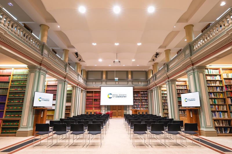 view from back of library towards rows of seats towards screen