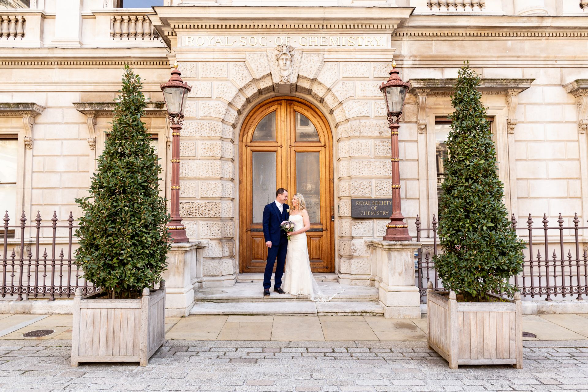 Newly married couple outside Burlington House front door.jpg