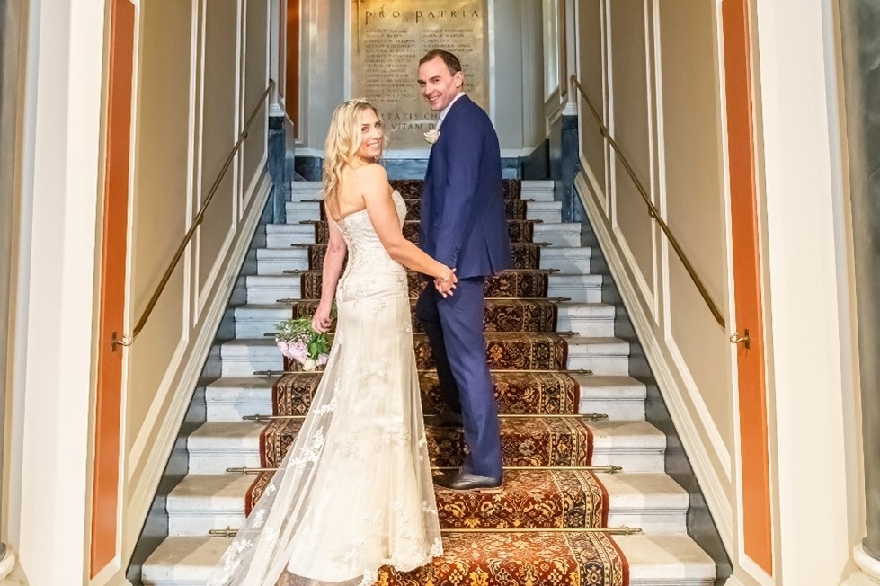 Newly married couple standing on stairs.jpg