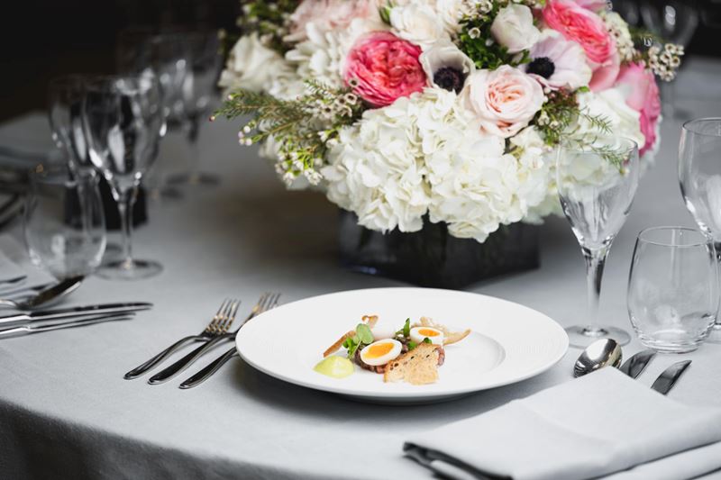 starter on table next to colourful flowers